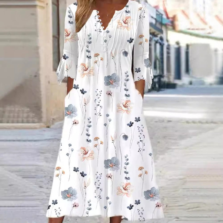Women's flowing maxi dress with V-neck, chest yoke, ruffled sleeves and pockets StylebySassy