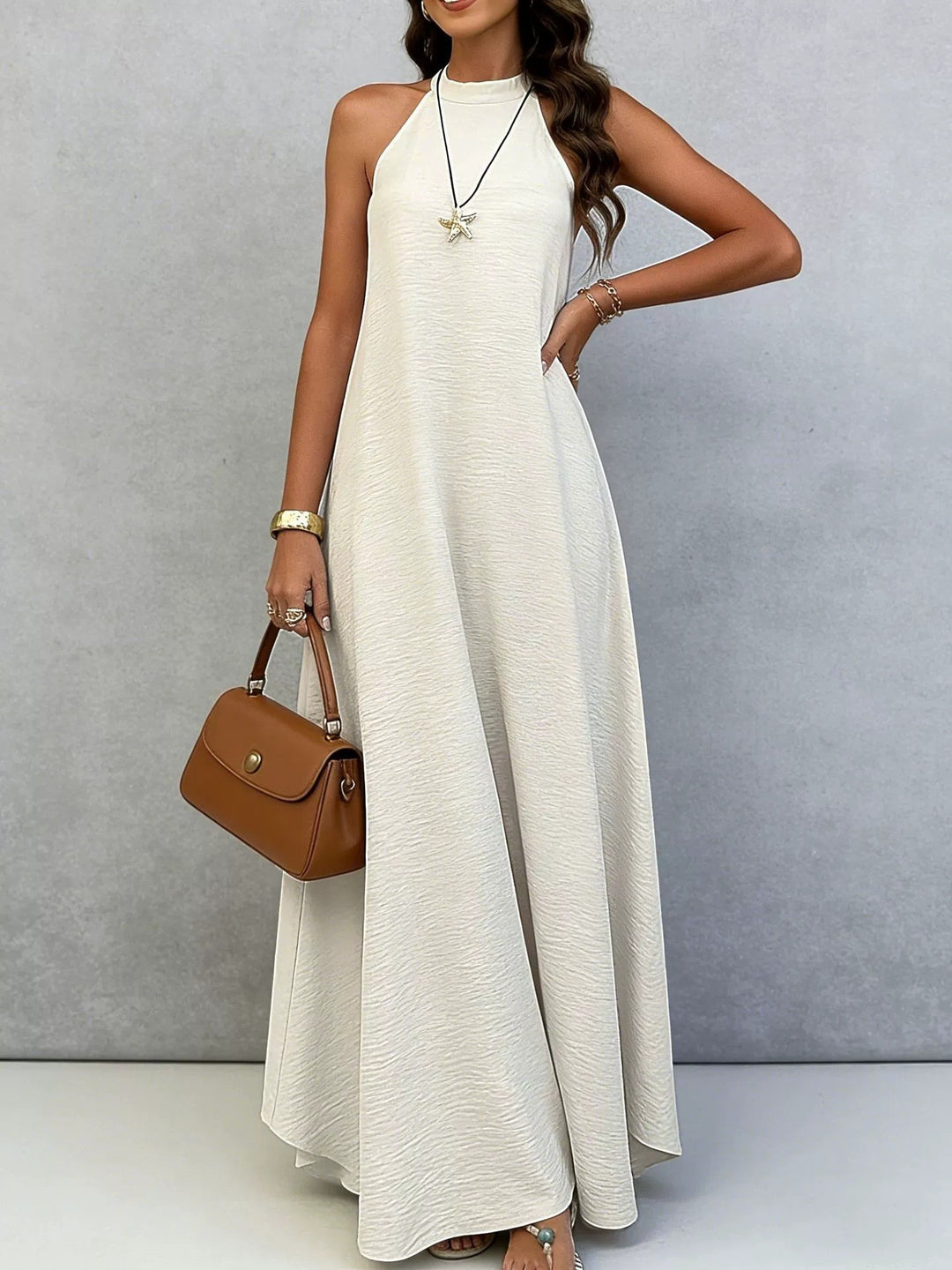 Women’s sleeveless maxi dress with high standing collar, flowing A-line and crepe texture StylebySassy