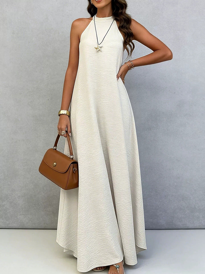 Women’s sleeveless maxi dress with high standing collar, flowing A-line and crepe texture StylebySassy