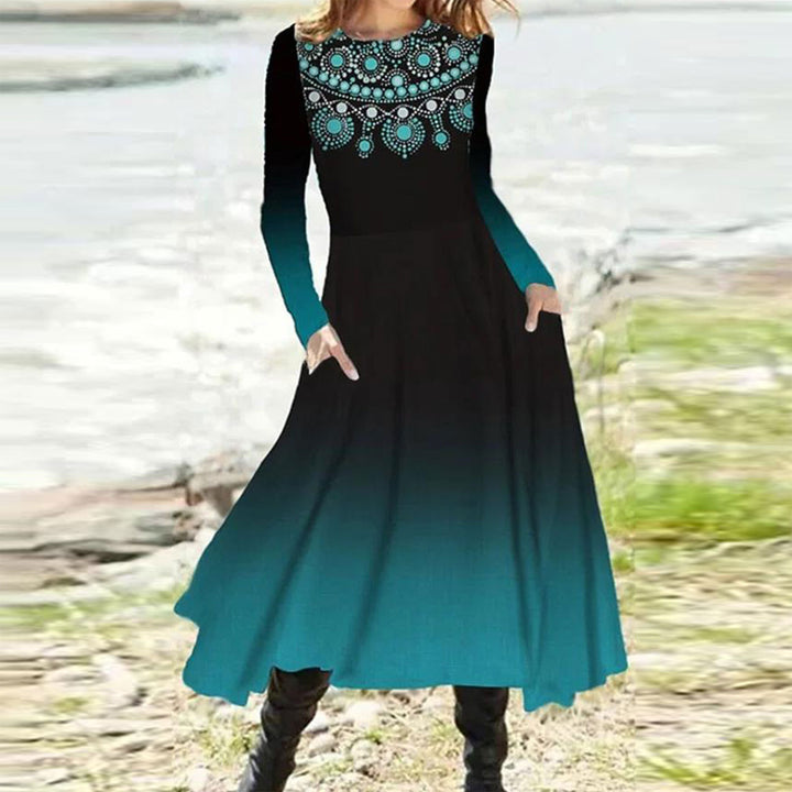 Women's flowing maxi dress with tie-dye circle pattern, round neckline, waist seam, and side pockets StylebySassy