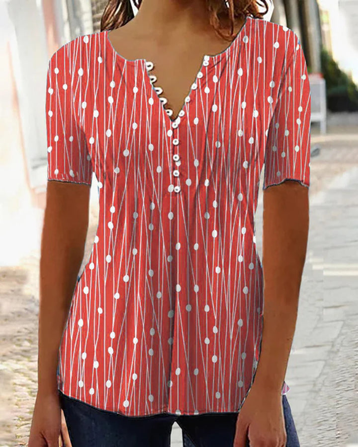 Women's airy V-neck blouse with short sleeves, decorative button placket and graphic dot stripe pattern StylebySassy