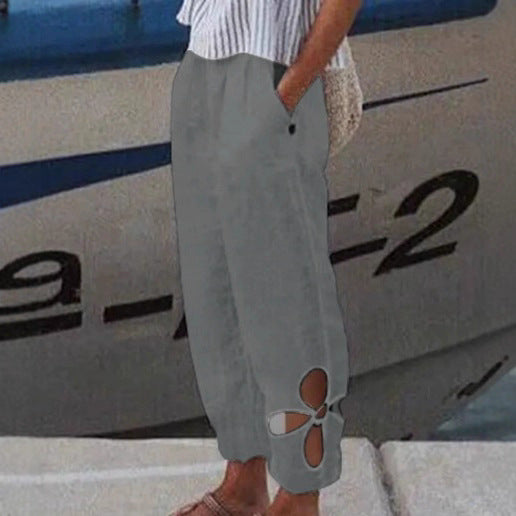 Women's ankle-length culotte pants with elastic waistband, side pockets, and floral hem cutout StylebySassy