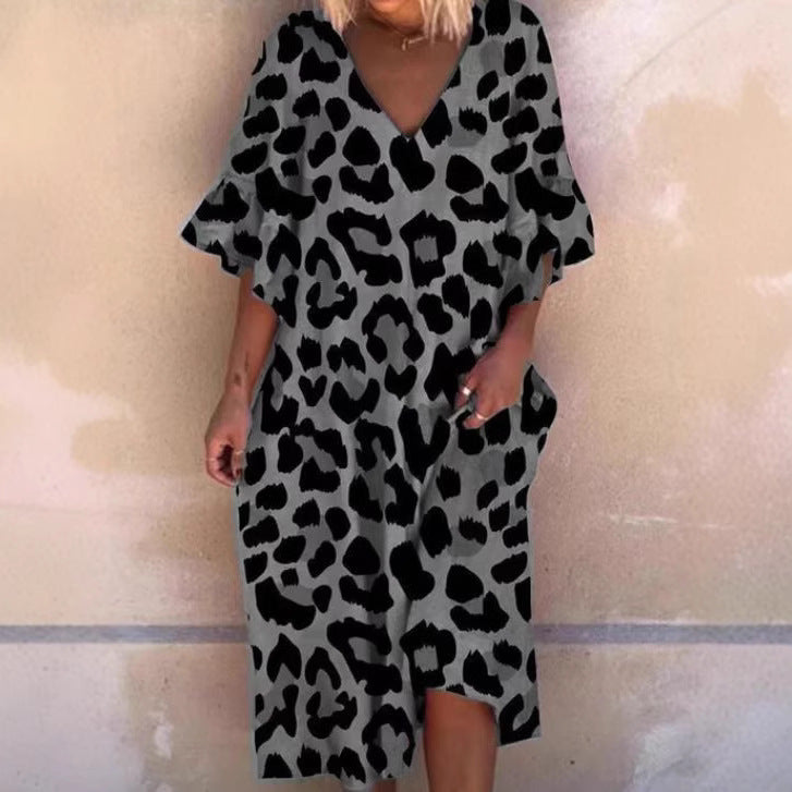 Ladies' casual midi dress in tunic style with V-neck, ruffled sleeves, and side pockets StylebySassy