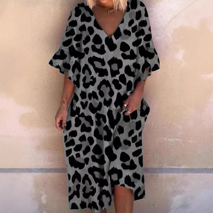 Ladies' casual midi dress in tunic style with V-neck, ruffled sleeves, and side pockets StylebySassy