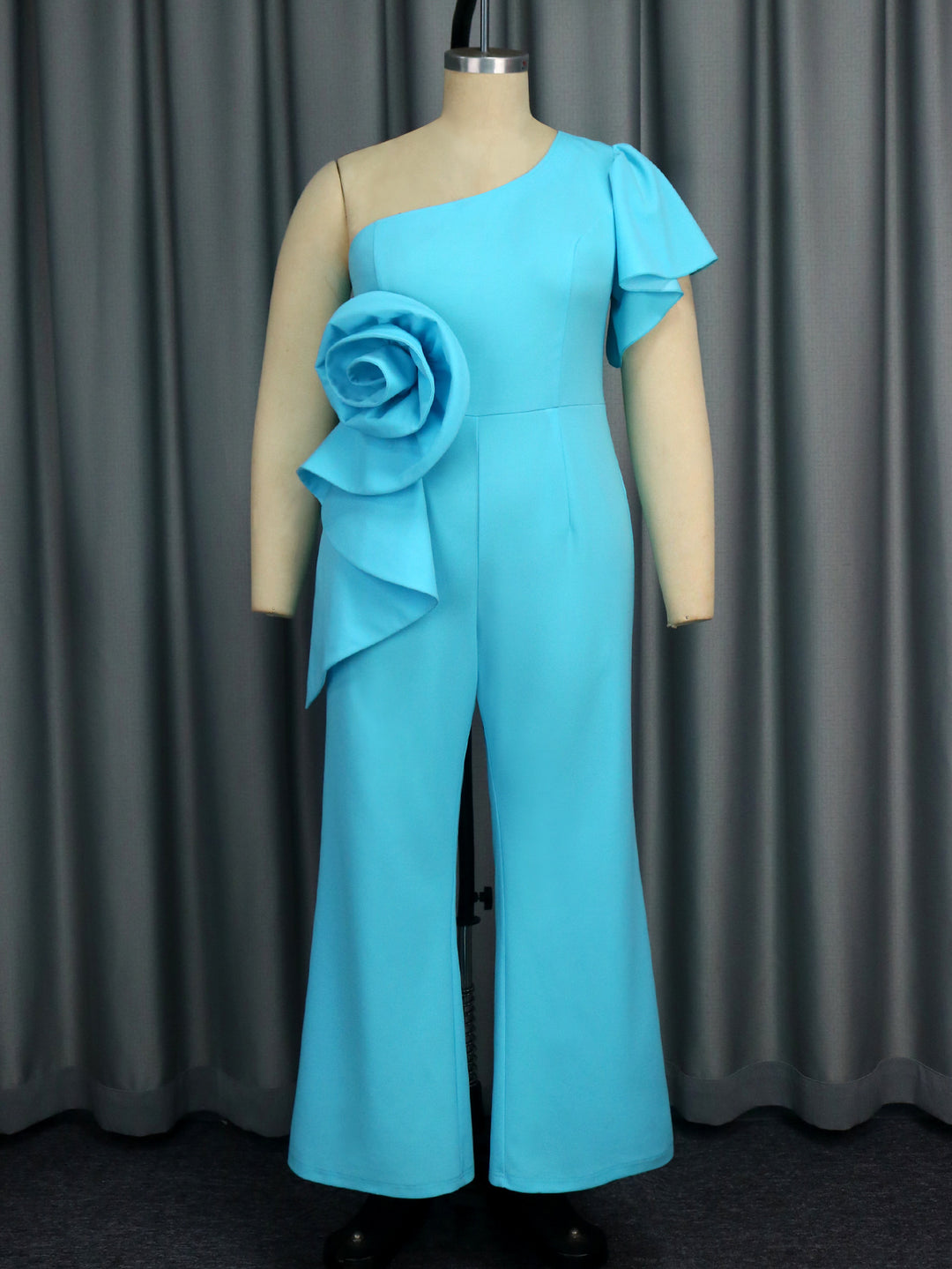 Ladies elegant jumpsuit with asymmetric design and floral appliqué StylebySassy
