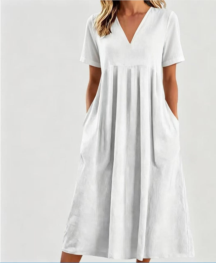 Women nan legeres V-neck midi dress with side pockets and gathered empire seam StylebySassy