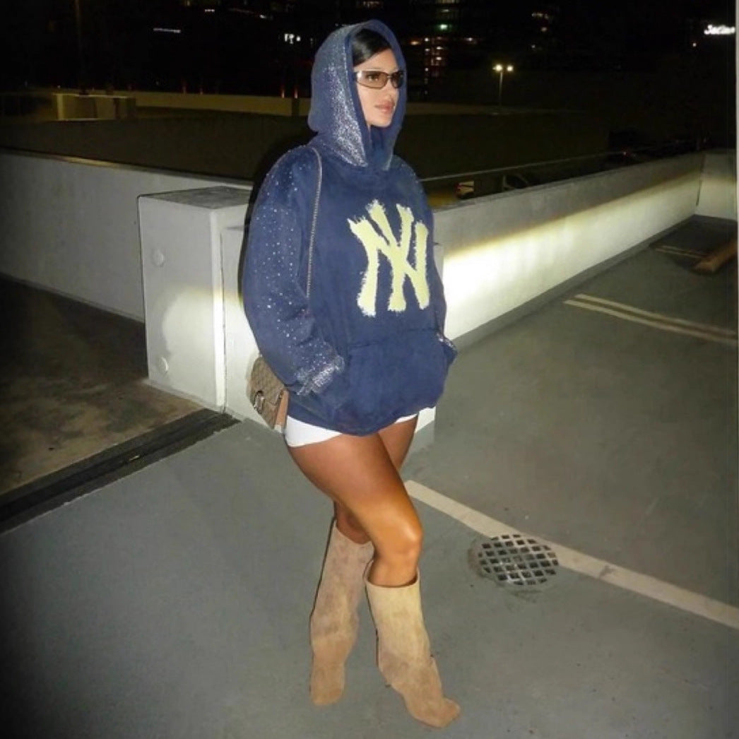 Women's oversized hoodie made of velvet fleece with distinctive logo print, glitter trim, and kangaroo pocket StylebySassy