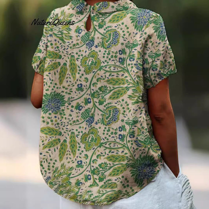 Women's casual short-sleeve blouse with V-neck, rounded hem, and botanical all-over print StylebySassy