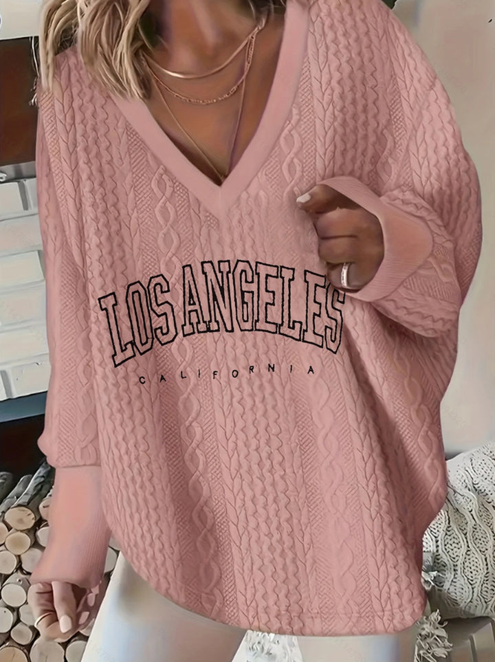 Women's oversized cable knit sweater with V-neck and logo print StylebySassy