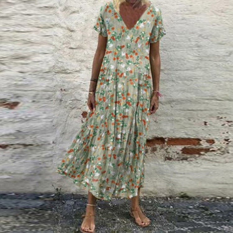 Women’s V-neck maxi dress with fine pleated skirt, empire bodice and short sleeves StylebySassy