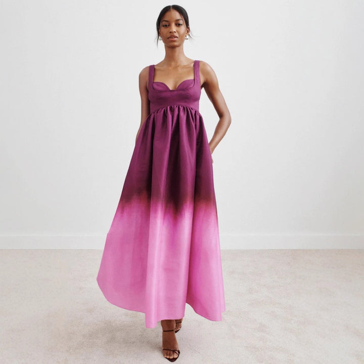 Women's floor-length bustier maxi dress with heart-shaped neckline, wide straps, and gathered empire waist StylebySassy