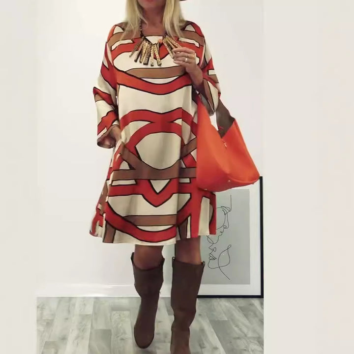 Women's generous swing dress with wide tulip hem, batwing sleeves and graphic all-over pattern StylebySassy