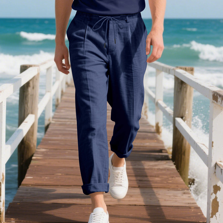Men's beach-suitable linen blend lounge pants with elastic drawstring, subtle pleat, and rolled ankle hem StylebySassy