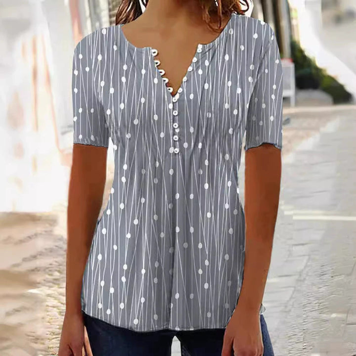 Women's lightweight tunic blouse with V-neck, decorative button placket, and empire gathering StylebySassy