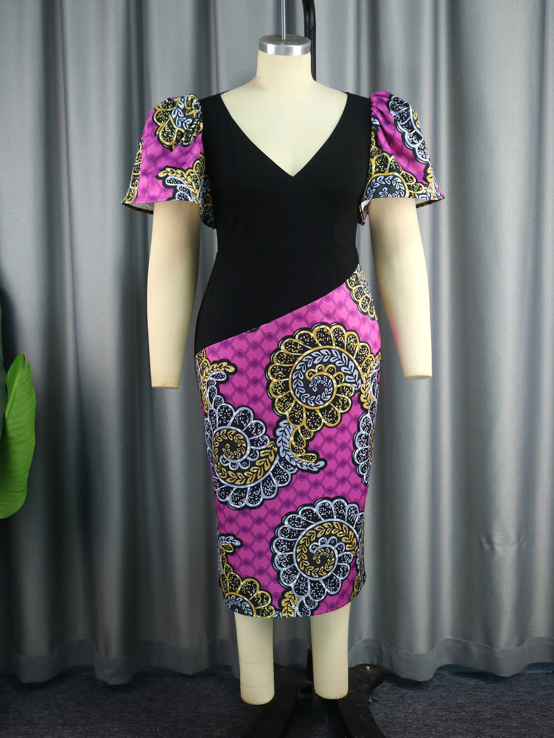 Women's fitted dress with colorful puff sleeves and asymmetrical design StylebySassy