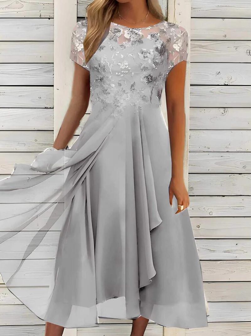 Women's elegant chiffon midi dress with floral lace appliqué and flowing A-line skirt StylebySassy