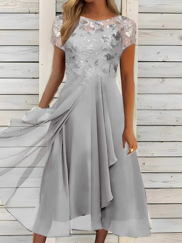 Women's elegant chiffon midi dress with floral lace appliqué and flowing A-line skirt StylebySassy