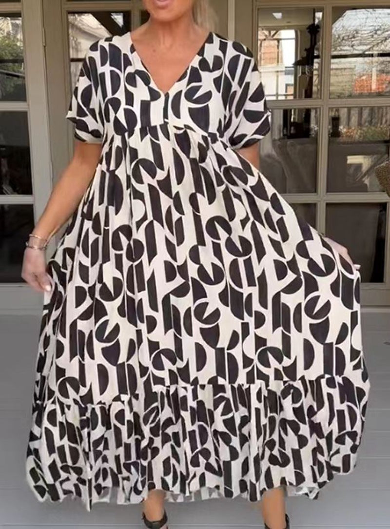Women's voluminous maxi dress with under-bust seam, V-neck, short kimono sleeves, and tiered ruffle StylebySassy