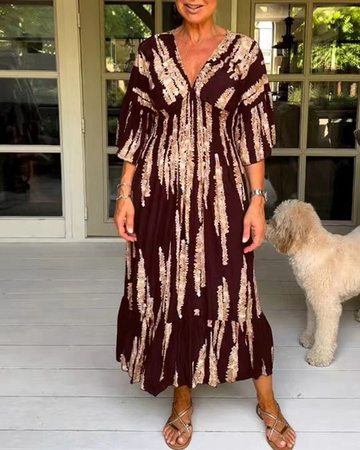 Ladies' V-neck maxi dress with brushstroke pattern, gathered underbust, balloon sleeves, and ruffled tiers StylebySassy