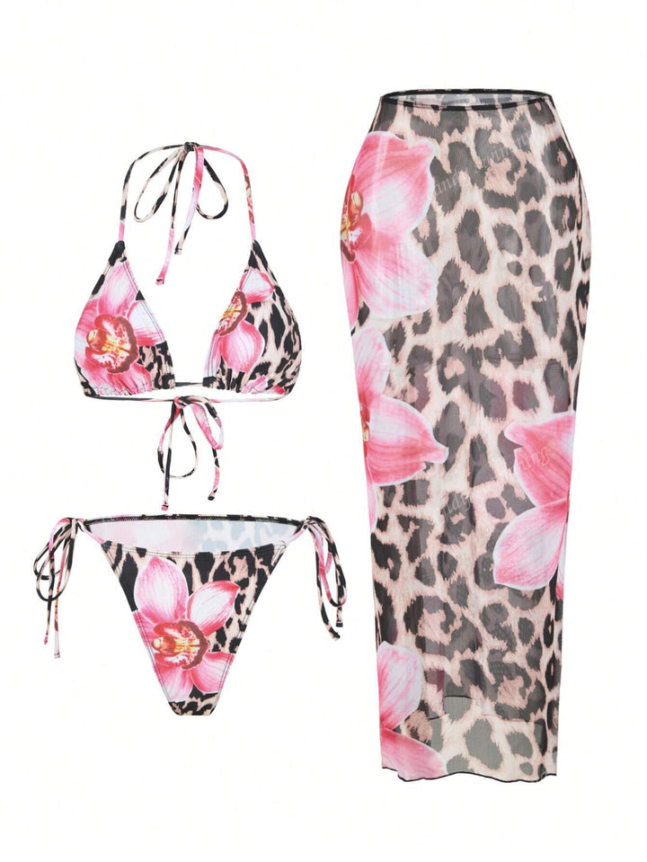 Women's triangle bikini set with floral patterns and transparent maxi skirt StylebySassy