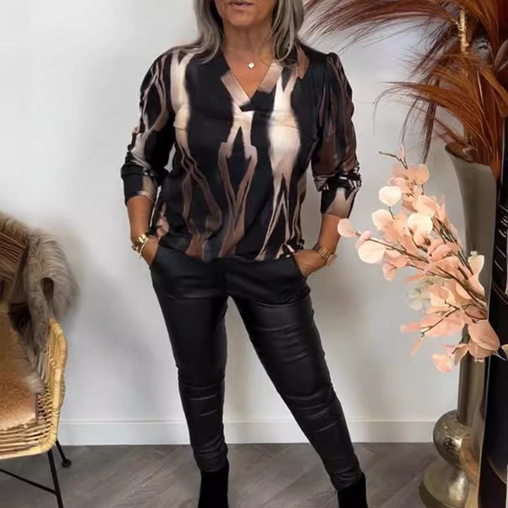 Women stylish casual set made of V-neck print shirt and leather look leggings StylebySassy