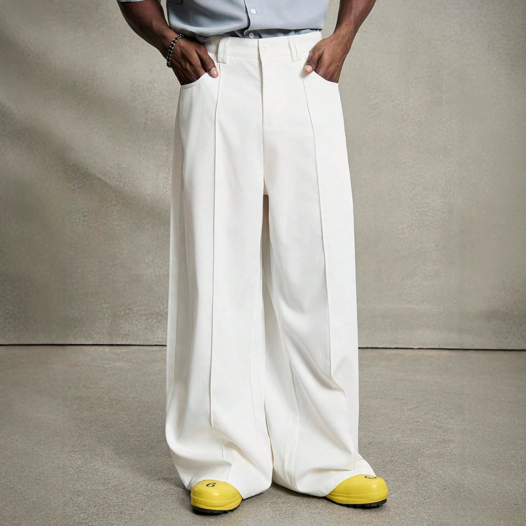 Men's wide pleated pants with high waistband, precise creases, and side inset pockets StylebySassy