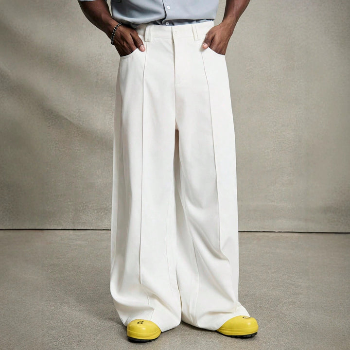 Men's wide pleated pants with high waistband, precise creases, and side inset pockets StylebySassy