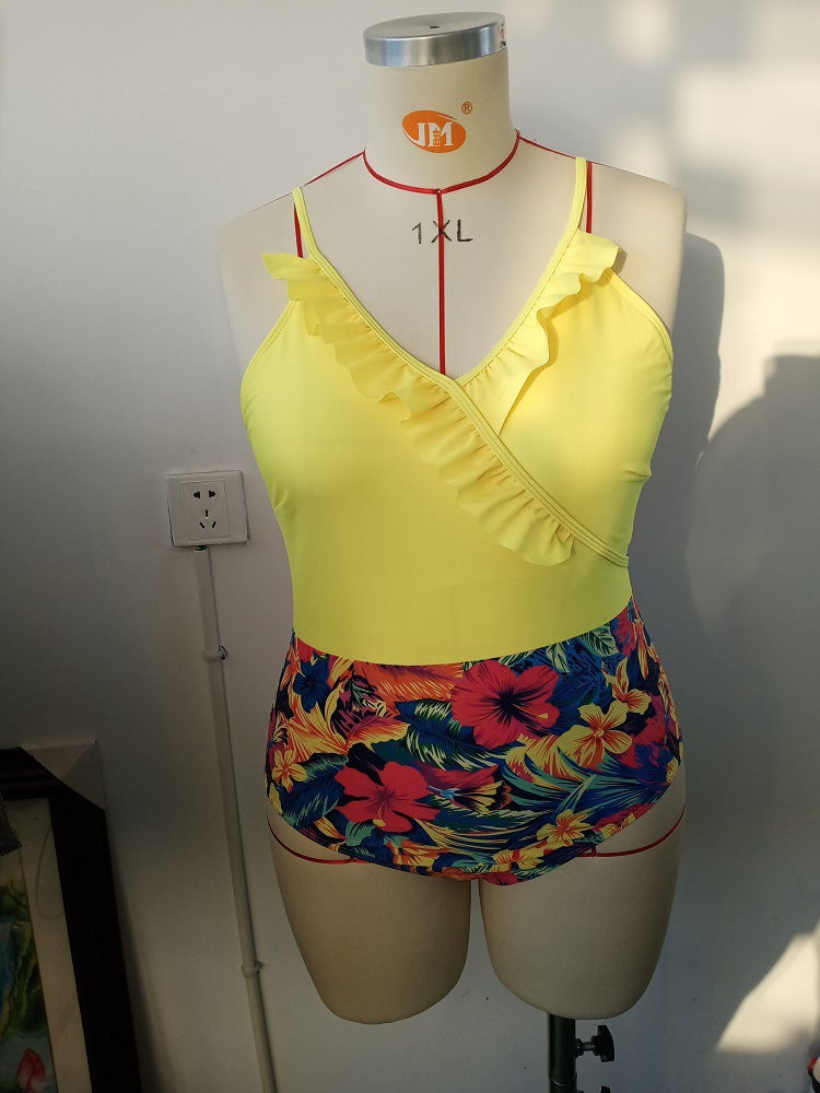 Women's one-piece swimsuit with asymmetrical ruffle design and floral pant area StylebySassy