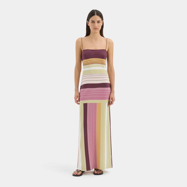 Women's figure-hugging maxi dress with spaghetti straps, straight neckline, panel stripes, and side slit StylebySassy