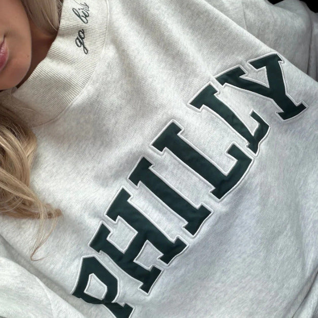 Women's oversized college sweatshirt with high stand-up collar and sewn-on lettering StylebySassy