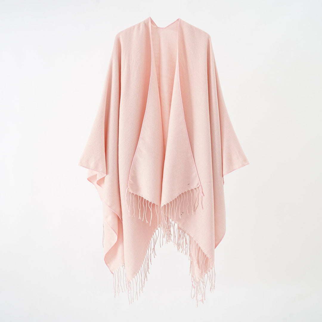 Women's fashionable fringe poncho made of soft material with luxurious drape StylebySassy