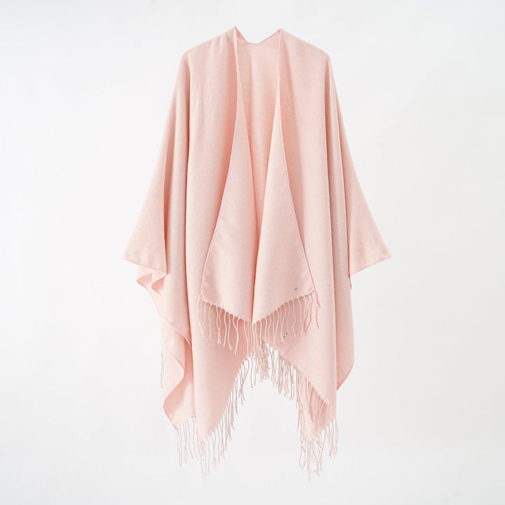 Women's fashionable fringe poncho made of soft material with luxurious drape StylebySassy