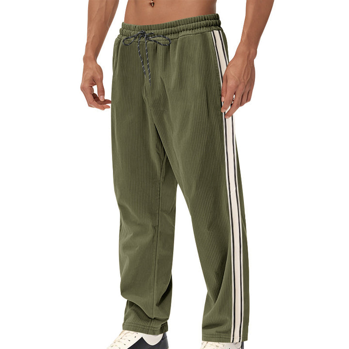 Men's loose training pants in corduroy look with drawstring waistband and side contrast stripes StylebySassy