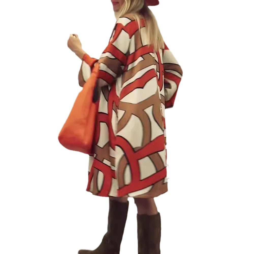 Women's generous swing dress with wide tulip hem, batwing sleeves and graphic all-over pattern StylebySassy
