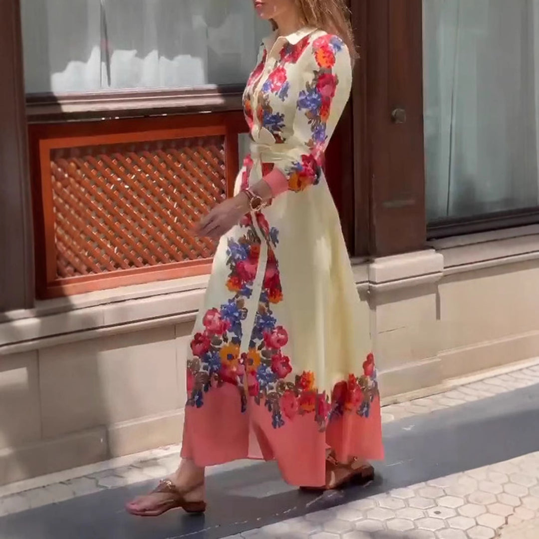 Women's long hem blouse dress with floral print, tie belt, and ruffle trim StylebySassy