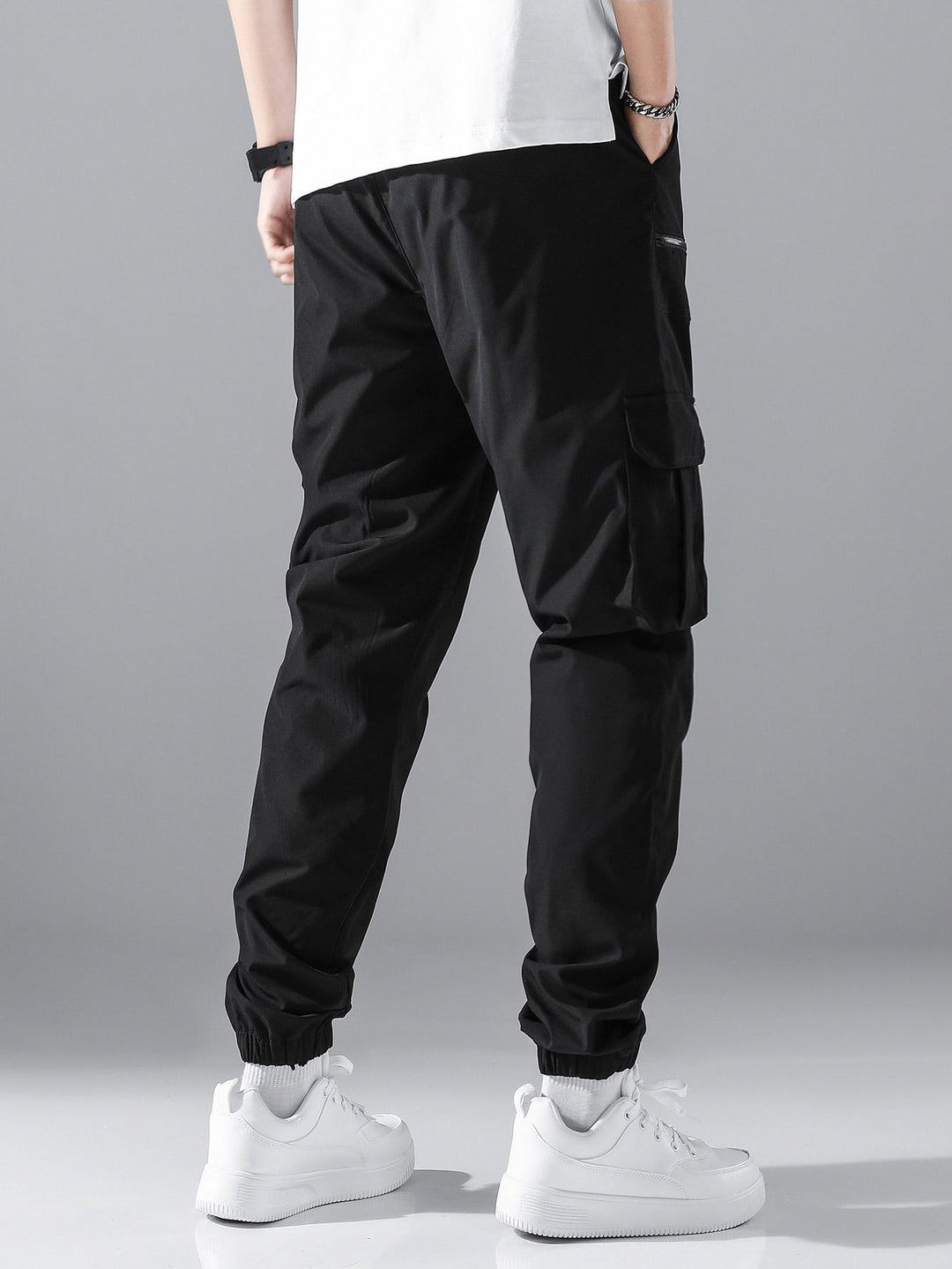 Men's slim cargo joggers with multiple zippered pockets, elastic ankle cuff, and drawstring StylebySassy