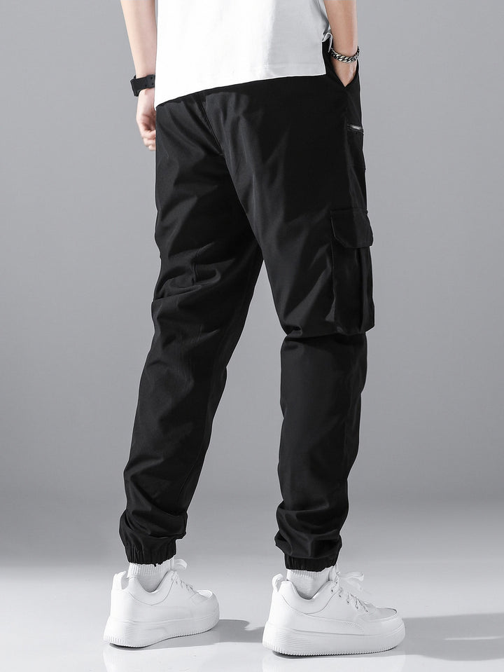 Men's slim cargo joggers with multiple zippered pockets, elastic ankle cuff, and drawstring StylebySassy