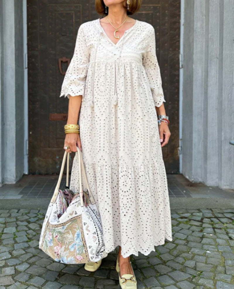 Women's flowing maxi dress with openwork embroidery, V-neck, underbust seam, and ruffled skirt StylebySassy