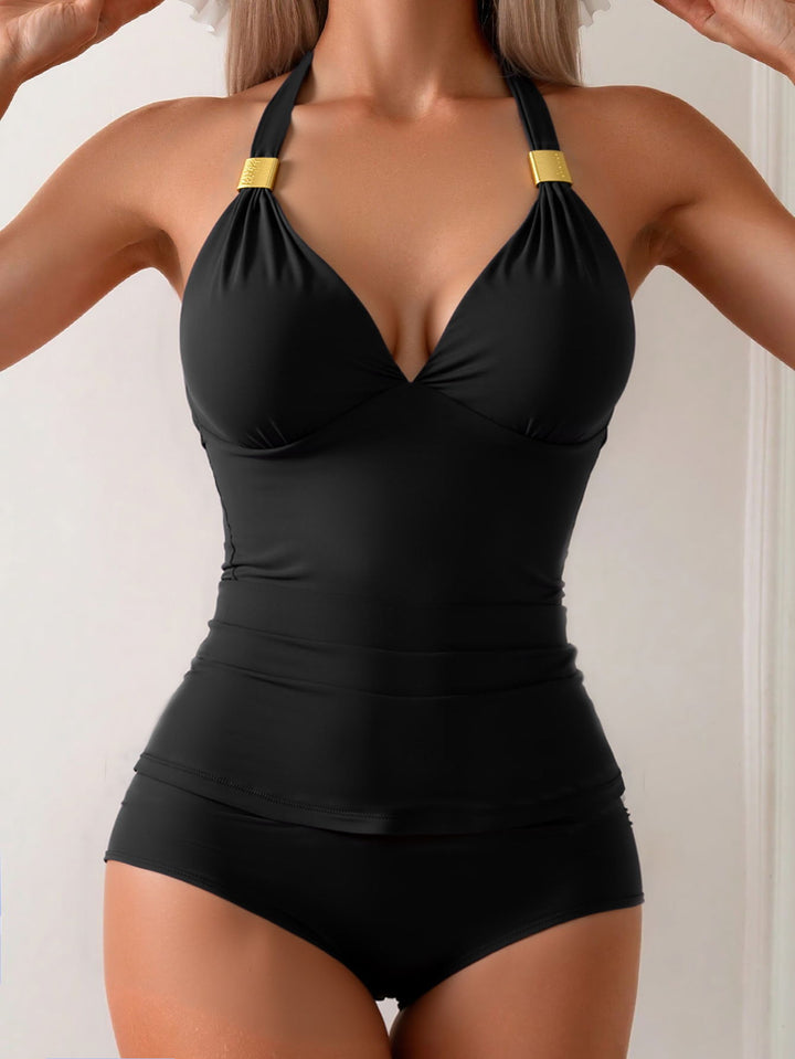 Ladies elegant swimsuit with sophisticated V-neck and golden details StylebySassy