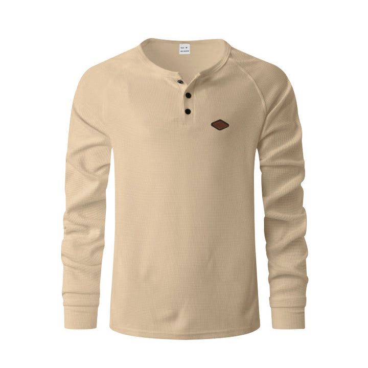 Men's structured long-sleeve shirt with short button placket, raglan sleeves, and subtle logo application StylebySassy