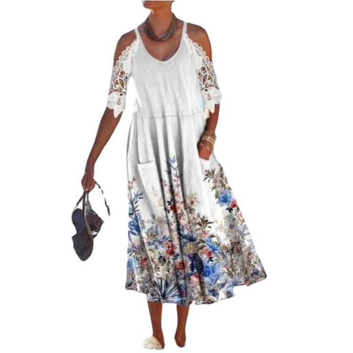 Women’s flowing maxi dress with shoulder cutouts crochet lace sleeves A-line cut and side pockets StylebySassy