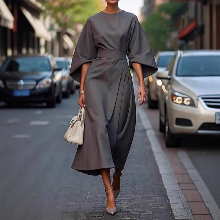 Women's minimalist evening dress with overlong wide sleeves and waist-sculpting pleat draping StylebySassy