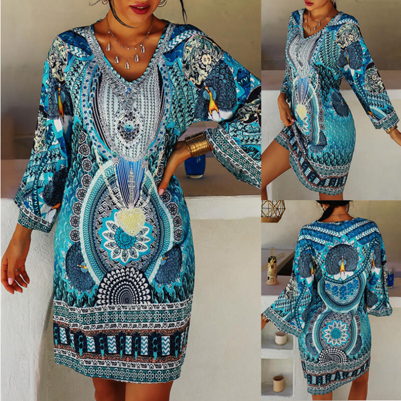 Women's short holiday tunic dress in kaftan style with V-neck and flared kimono sleeves StylebySassy