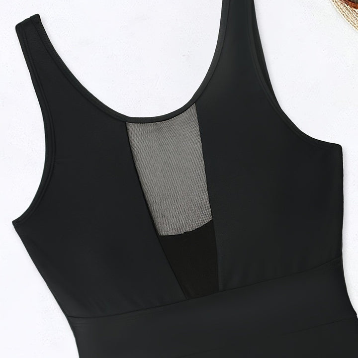Women’s sporty jumpsuit with deep V-neckline and transparent mesh details StylebySassy