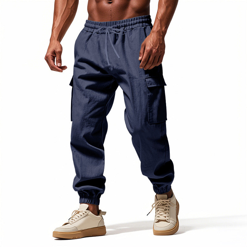 Men's tapered joggers in utilitarian style with elastic waistband, drawstring, and flap pockets StylebySassy