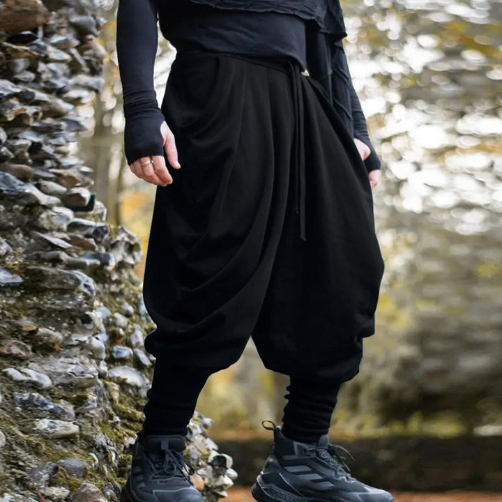 Men's avant-garde harem pants with wrap front, elastic waistband, and slim ankles StylebySassy