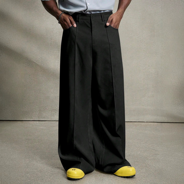 Men's wide pleated pants with high waistband, precise creases, and side inset pockets StylebySassy