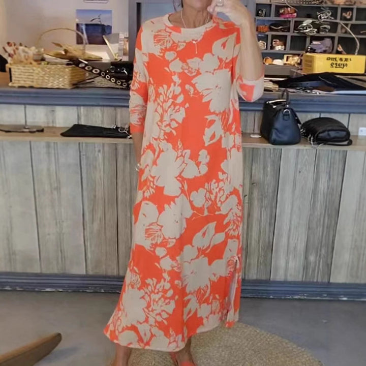 Women’s flowing A-line maxi dress with three-quarter sleeves round neckline side slit and inserted pockets StylebySassy