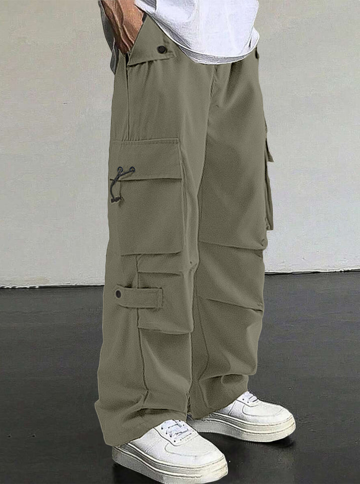 Men's baggy cargo pants with utilitarian flap pockets, drawstring waistband, and reinforced seams StylebySassy