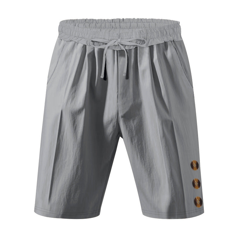 Men's knee-length casual Bermuda shorts with elastic tunnel drawstring waist, side slit pockets, and round decorative appliqués StylebySassy